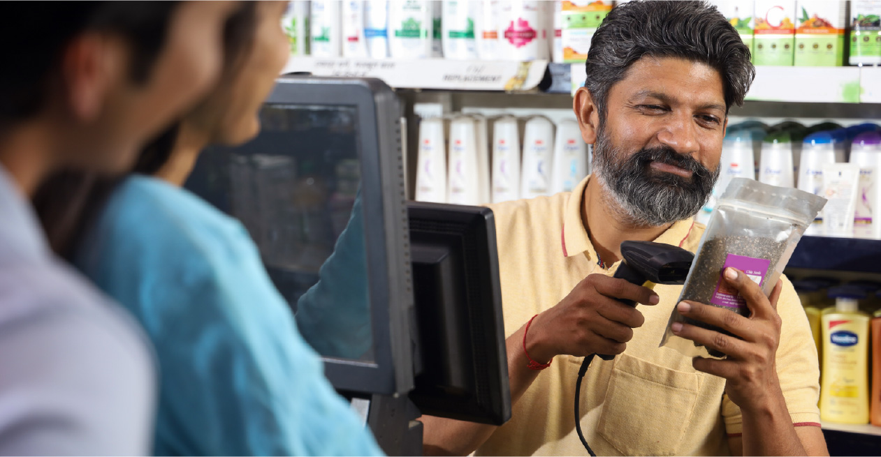 Shop worker scanning stock